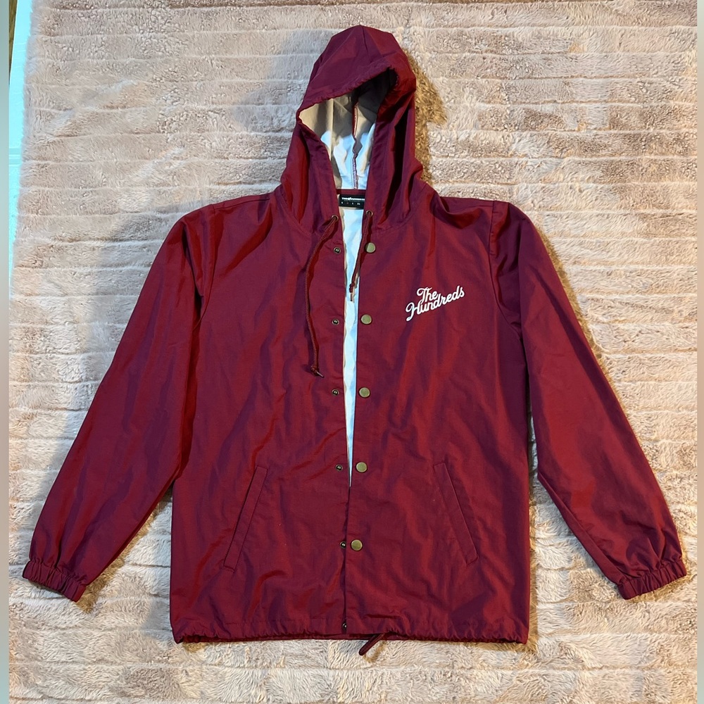 The Hundreds Maroon/Burgundy button up rain coat. Size MEDIUM